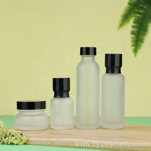 Wholesale Cosmetic Frosted glass bottle with black caps, frosted glass bottles/jars